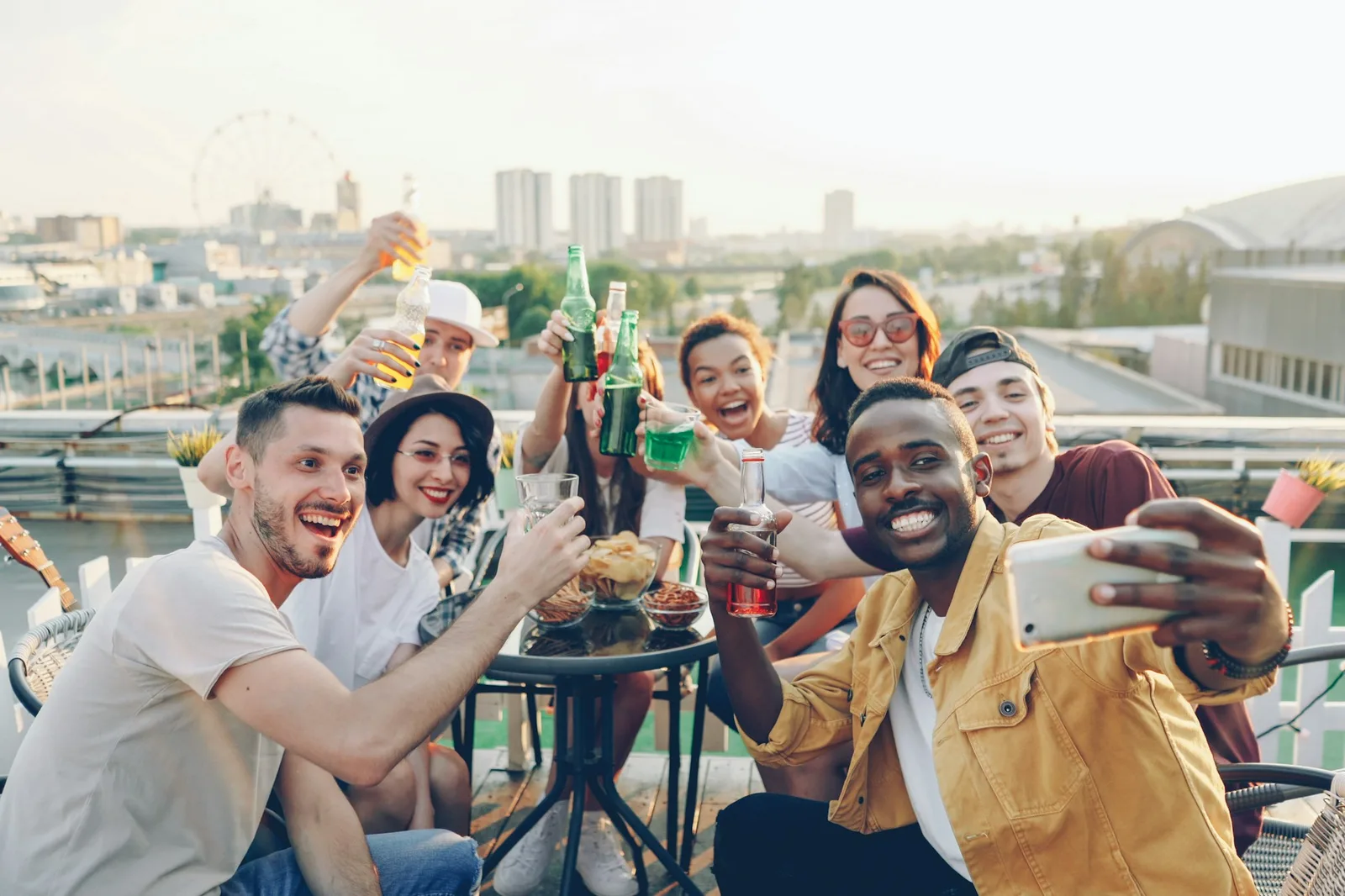 Friends taking a group selfie at a birthday party, the kind of guest photo a birthday party photo sharing QR code collects