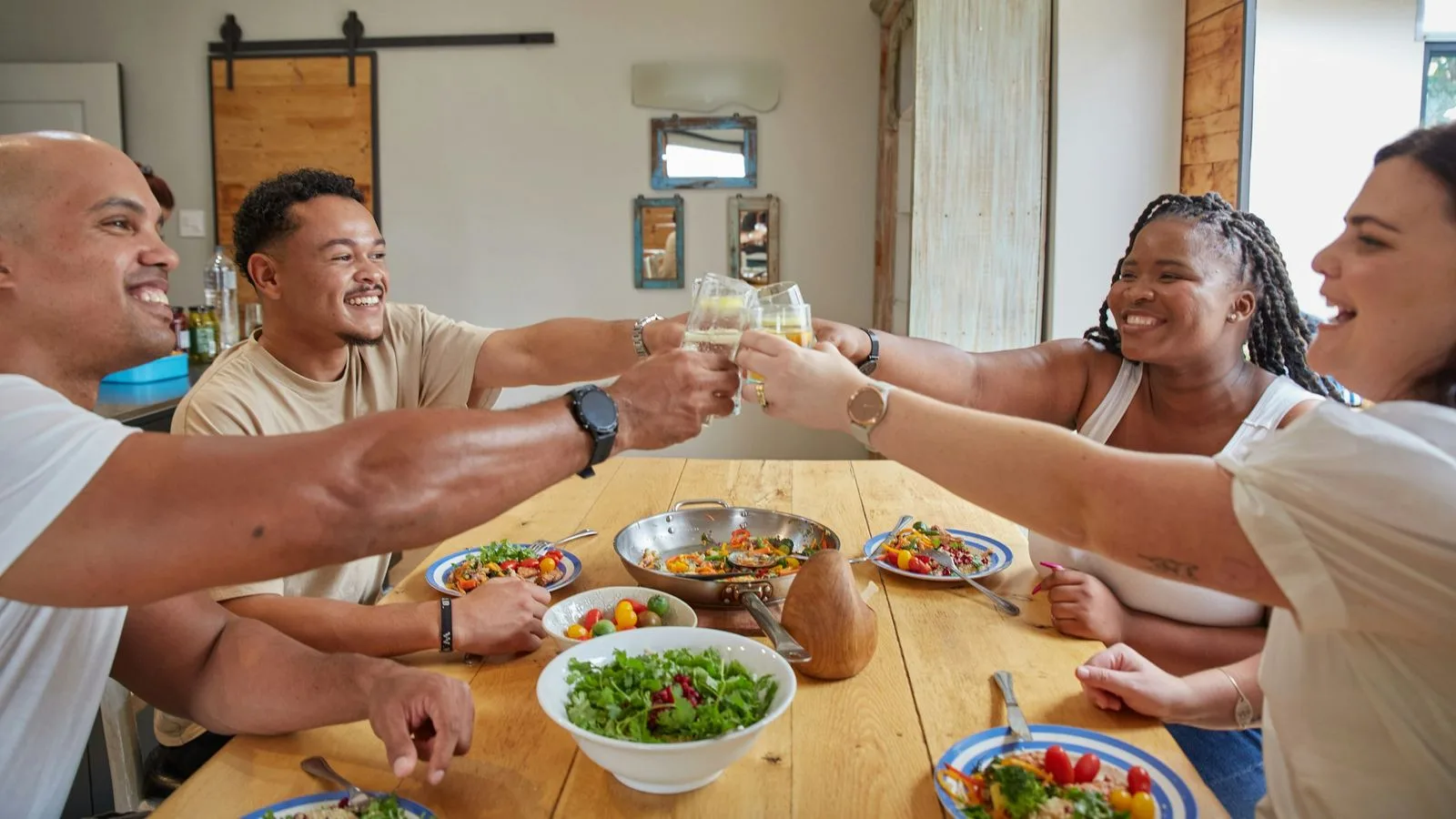 Colleagues raising a toast over a team lunch